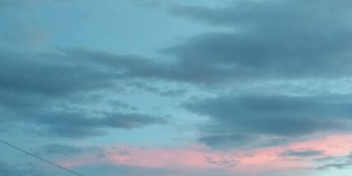 Low angle view of cloudy sky during sunset
