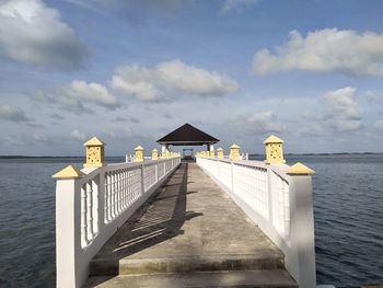 Pier over sea against sky