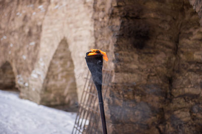 Close-up of flaming torch in castle