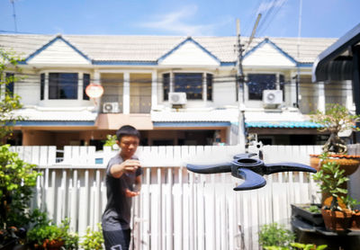 Man standing outside building