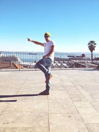 Full length of man against blue sky