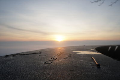 Scenic view of beach against sky during sunset