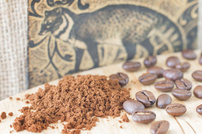 Close-up of coffee beans on table