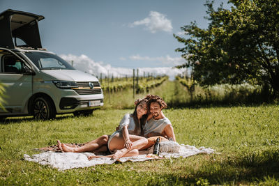 Couple having a picknick in front of their vanlife van