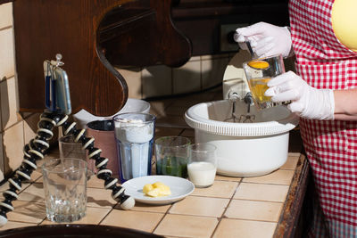 A woman prepares spinach muffins step by step, adds an egg yolk to the dough