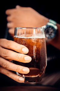 Close-up of hand holding ice cream