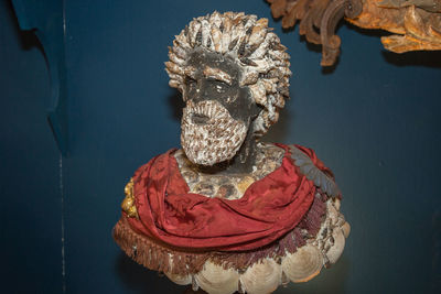 Bust, sculpture of a man with a beard made with sea shells.