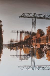 Reflection of trees in lake against sky