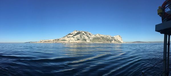 Scenic view of sea against clear blue sky