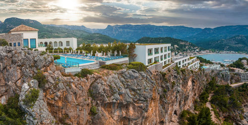 Aerial view of the luxury cliff house hotel on top of the cliff on the island of mallorca.