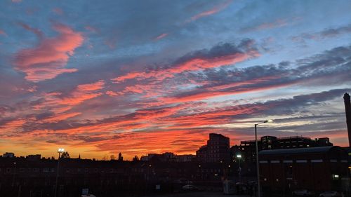 Silhouette buildings against sky during sunset