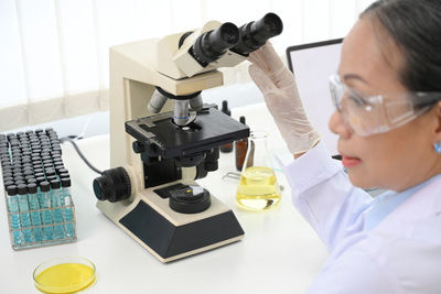 Close-up of scientist working in laboratory