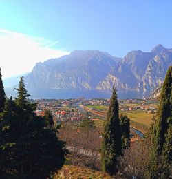 Scenic view of townscape against mountains