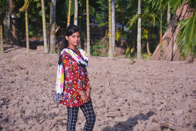 Full length of man standing in forest