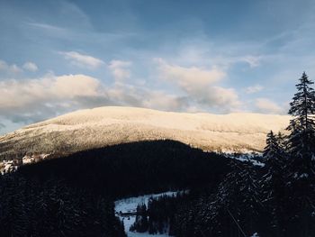 Scenic view of land against sky during winter