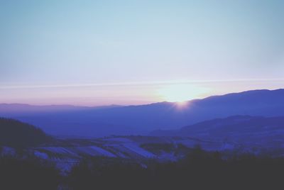 Scenic view of field against sky during sunset