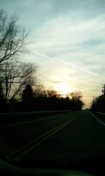 Empty road at sunset