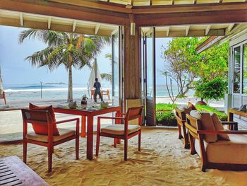 Chairs and tables in restaurant at beach