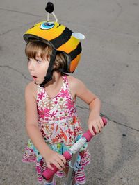 Low angle view of girl standing outdoors