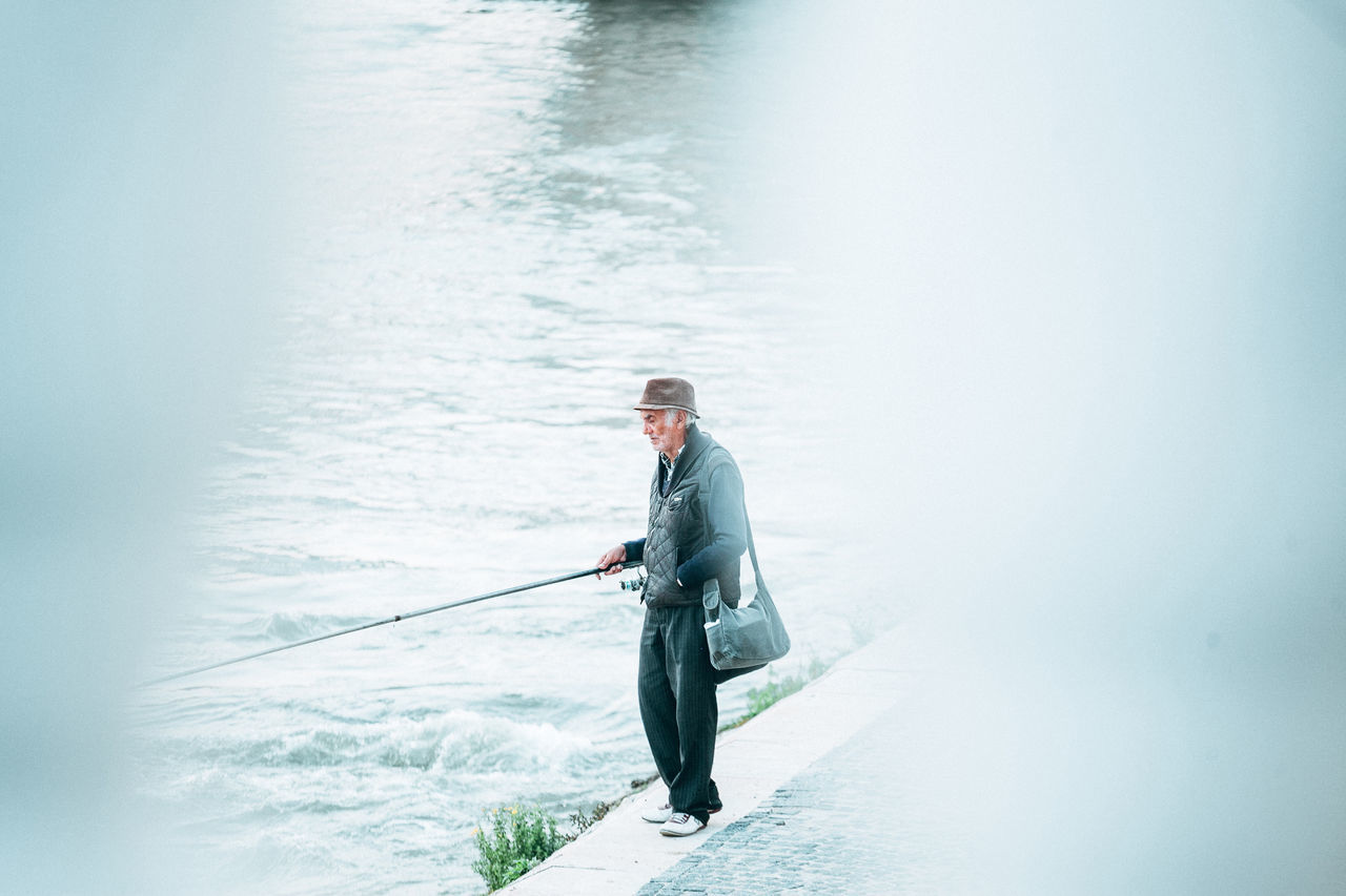one person, full length, water, day, copy space, nature, men, young adult, standing, smiling, portrait, young men, looking at camera, adult, businessman, business person, males, outdoors