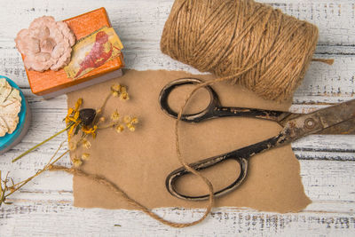 Directly above shot of art and craft equipment on wooden table