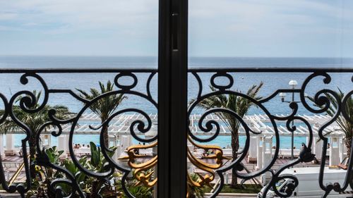 Close-up of railing against window