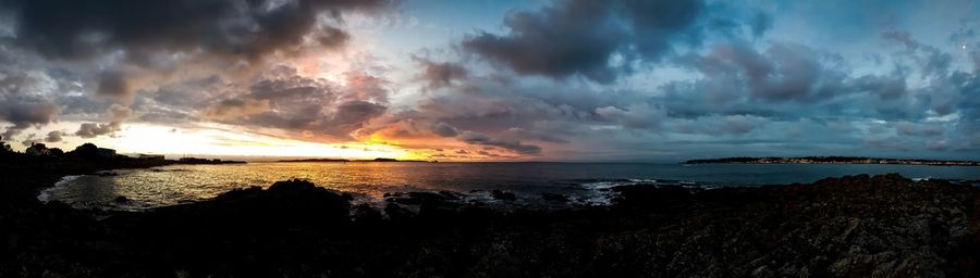 Panoramic view of sea against sky during sunset
