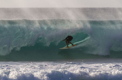 Man surfing on sea