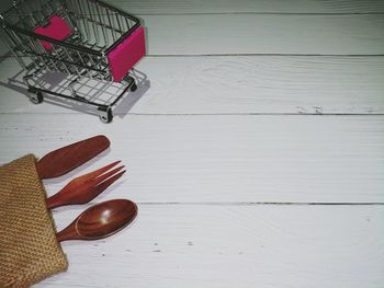 High angle view of shoes on wooden table