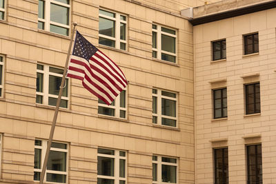 Flad on the united states of america with building on the background