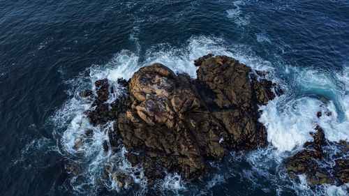 High angle view of rock formation on beach