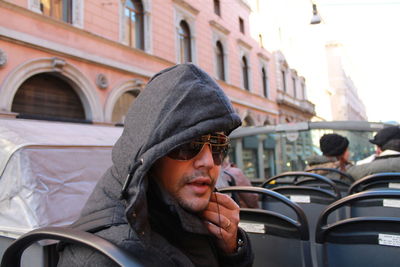 Portrait of young man in bus