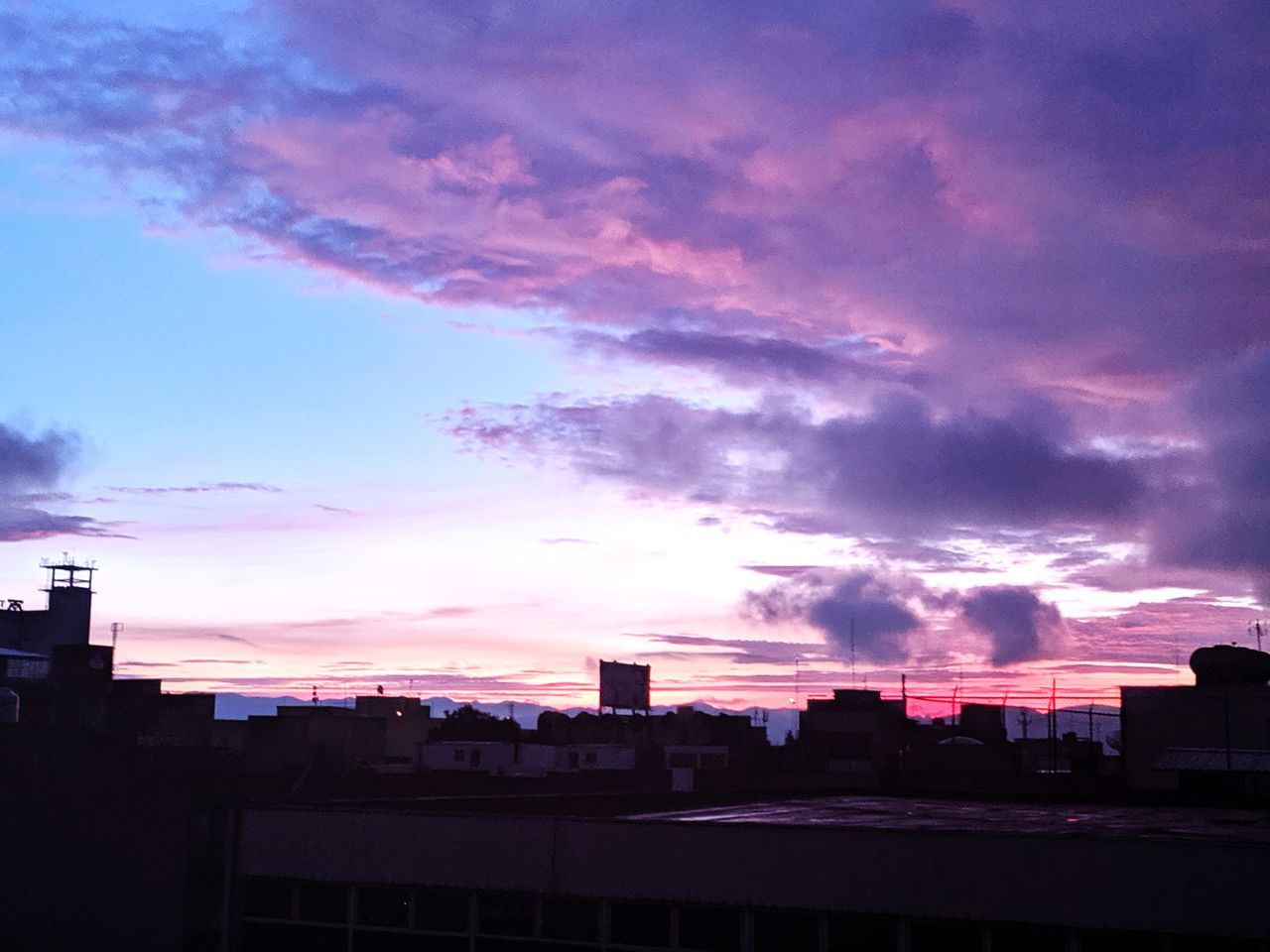 cloud - sky, sky, architecture, built structure, building exterior, city, sunset, nature, no people, building, pink color, silhouette, outdoors, dusk, residential district, dramatic sky, cityscape, purple, landscape, beauty in nature, romantic sky