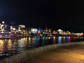 Illuminated city at waterfront