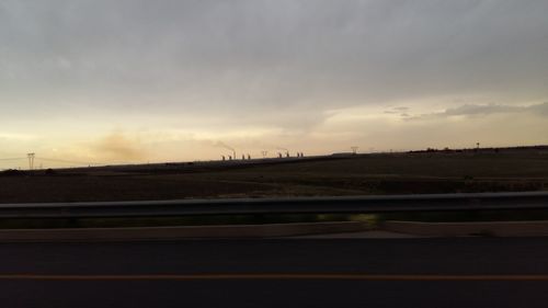 View of railroad track against cloudy sky