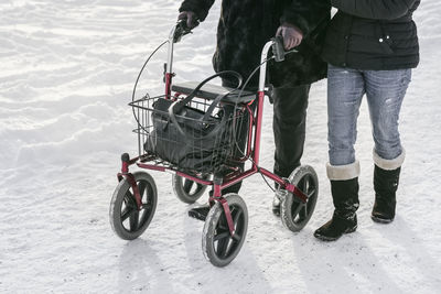 Low section of person using walking frame