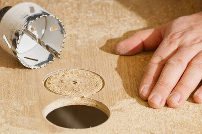 Cropped hand of person preparing food