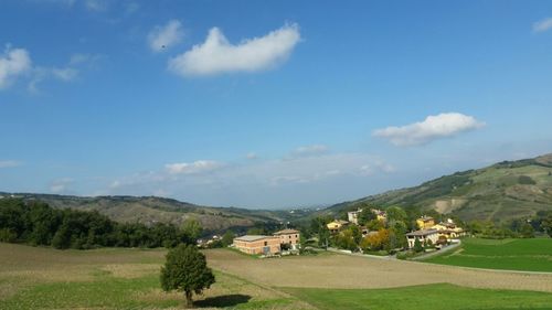 Scenic view of mountains against cloudy sky