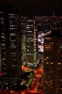 Aerial view of city lit up at night