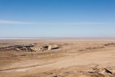 Scenic view of desert against clear sky