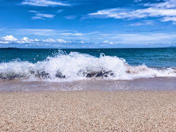 Scenic view of sea against blue sky