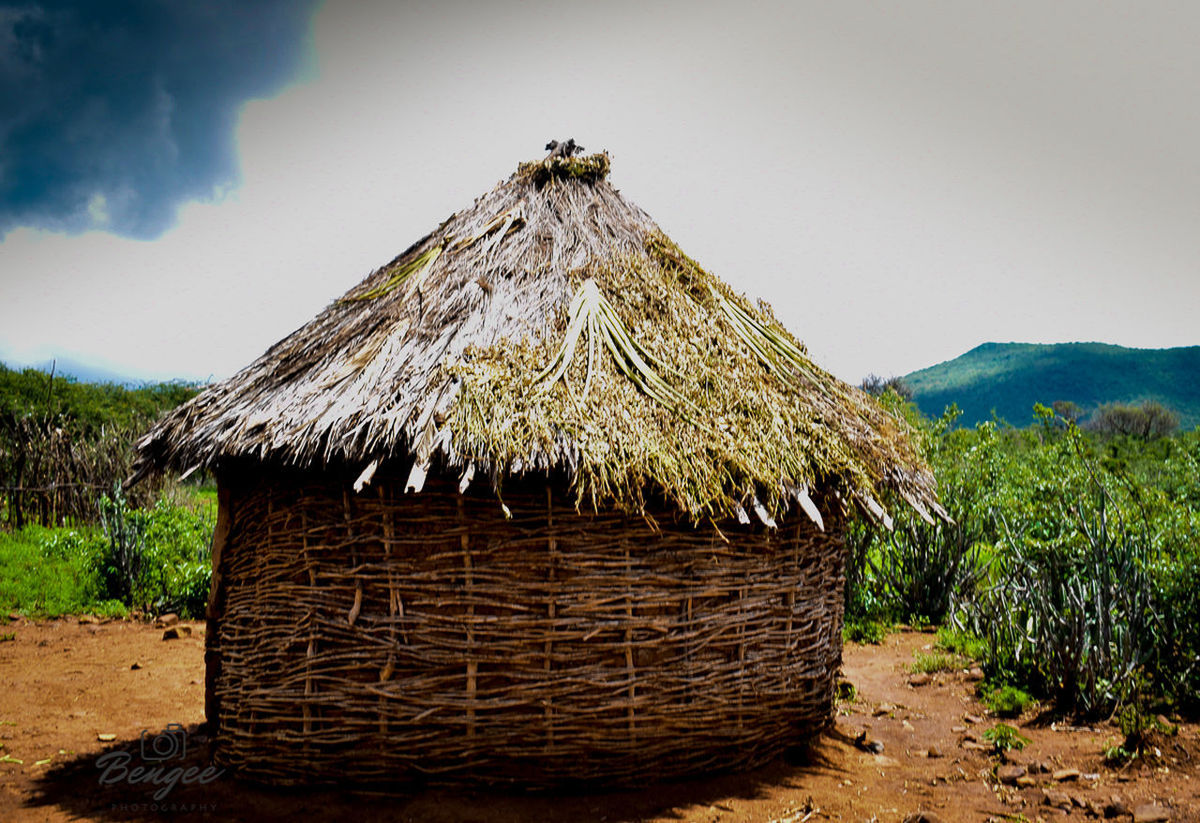 VIEW OF HUT ON LAND AGAINST SKY