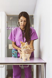 Portrait of a woman with cat