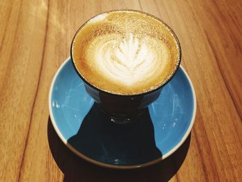 High angle view of cappuccino on table