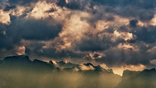 Panoramic view of mountains against sky during sunset