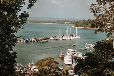 High angle view of harbor by sea against sky