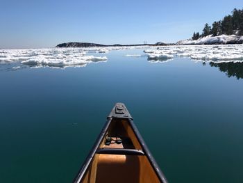 Sailboat on sea against clear sky