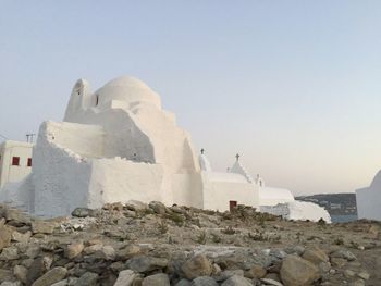 View of white buildings against clear sky