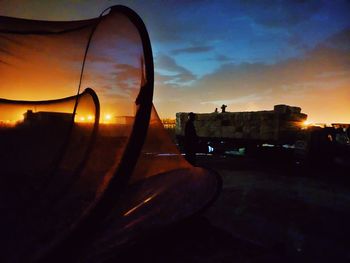 Close-up of cityscape against sky during sunset