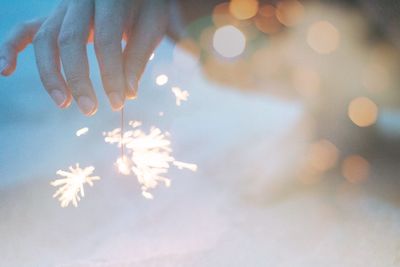 Close-up of hand holding illuminated light